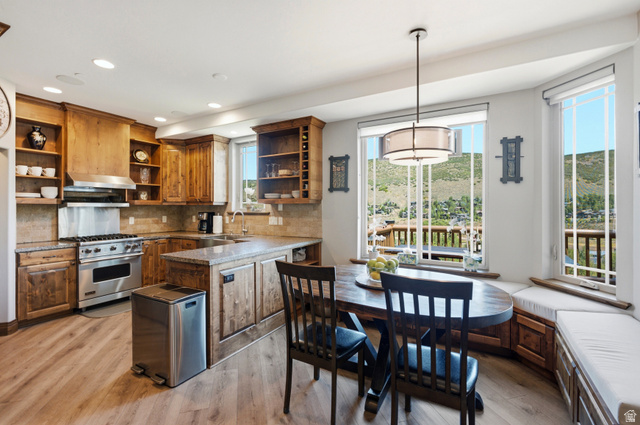 3148 Lower Saddleback Road Park City, UT 84098 - Photo 19 of 67 Kitchen with wood-finish flooring, custom wood cabinetry, and stone countertops