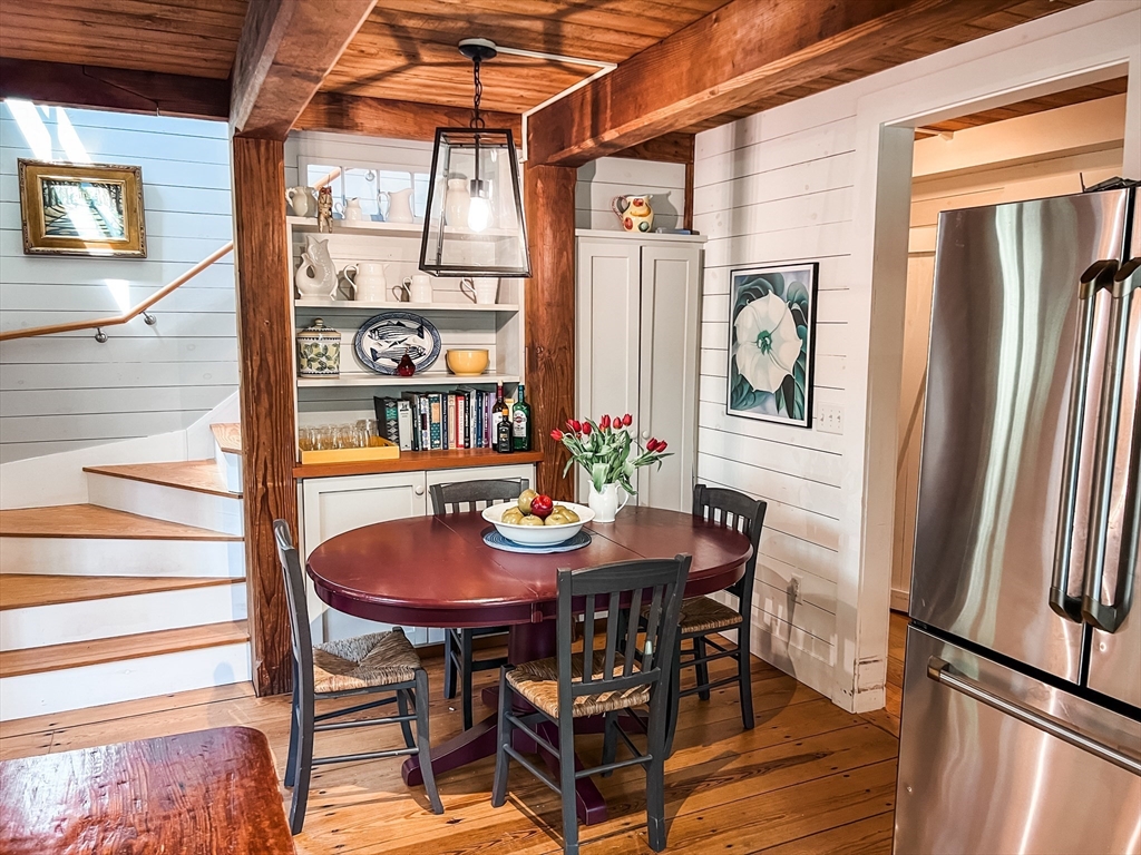 225 Lamberts Cove Road West Tisbury, MA 02568 - Photo 7 of 33 a view of a dining room with furniture and a window