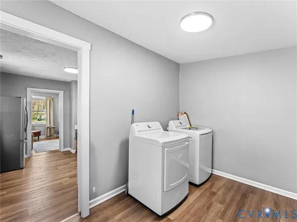 a view of utility room with wooden floor