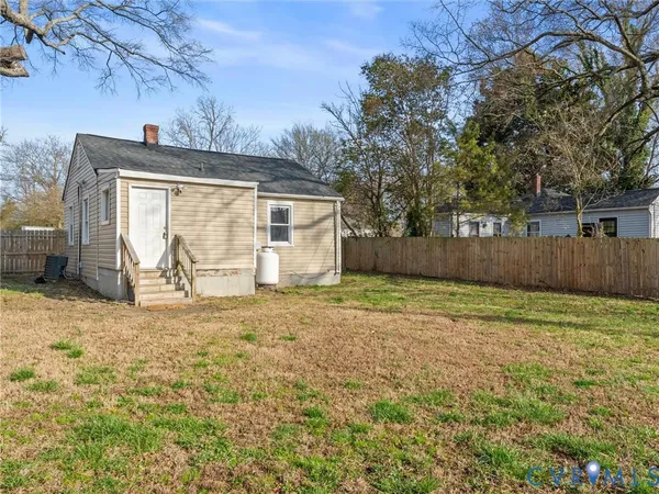 a view of a house with a yard and garage