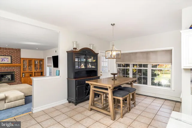 a view of a workspace with furniture and a kitchen