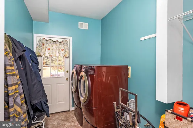 a utility room with dryer and washer