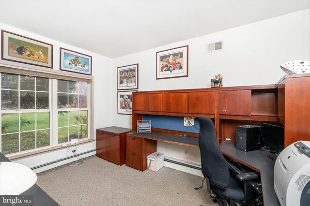 a bed room with a bed and a desk