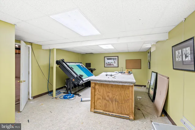 a view of a room with air conditioner duct and hardwood floor