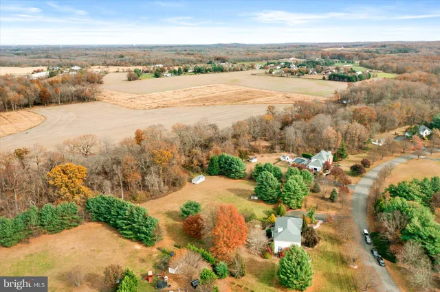 an aerial view of residential building and lake