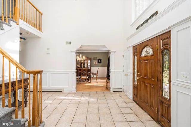 a view of a entryway door with interior of house