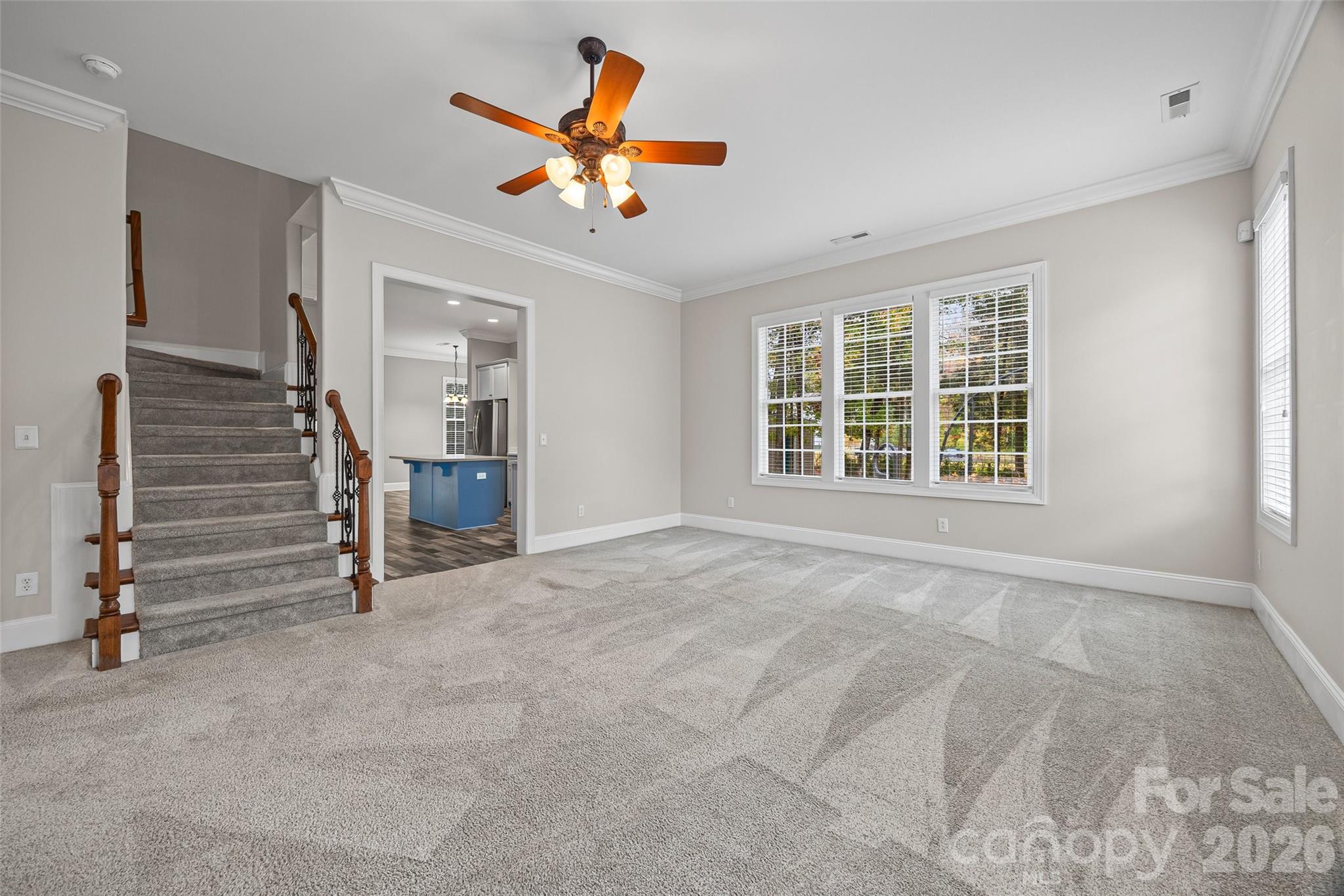 1576 Abercorn Street Northwest Concord, NC 28027 - Photo 21 of 48 an empty room with windows and ceiling fan