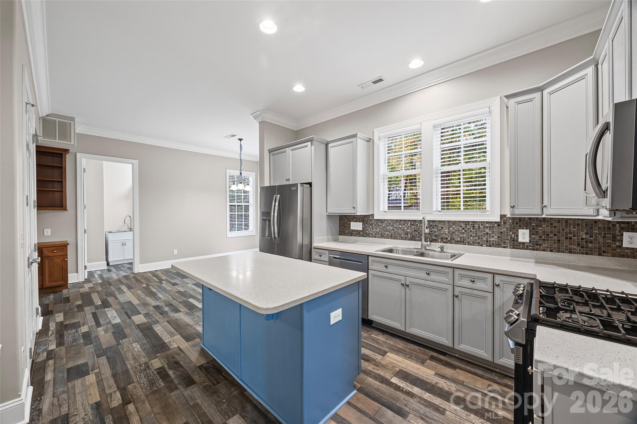1576 Abercorn Street Northwest Concord, NC 28027 - Photo 22 of 48 a kitchen with a sink stove and refrigerator