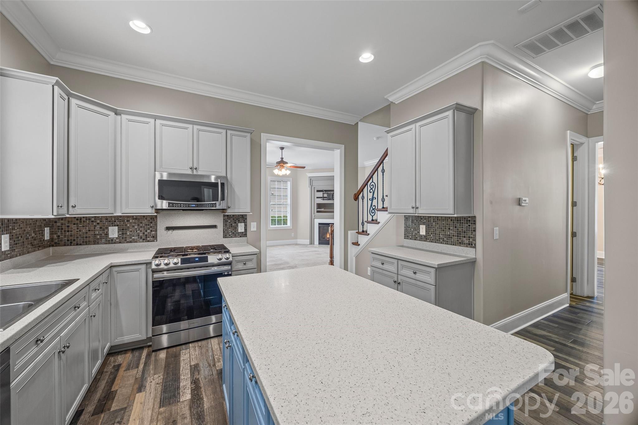 1576 Abercorn Street Northwest Concord, NC 28027 - Photo 25 of 48 a kitchen with stainless steel appliances a stove a sink and a refrigerator