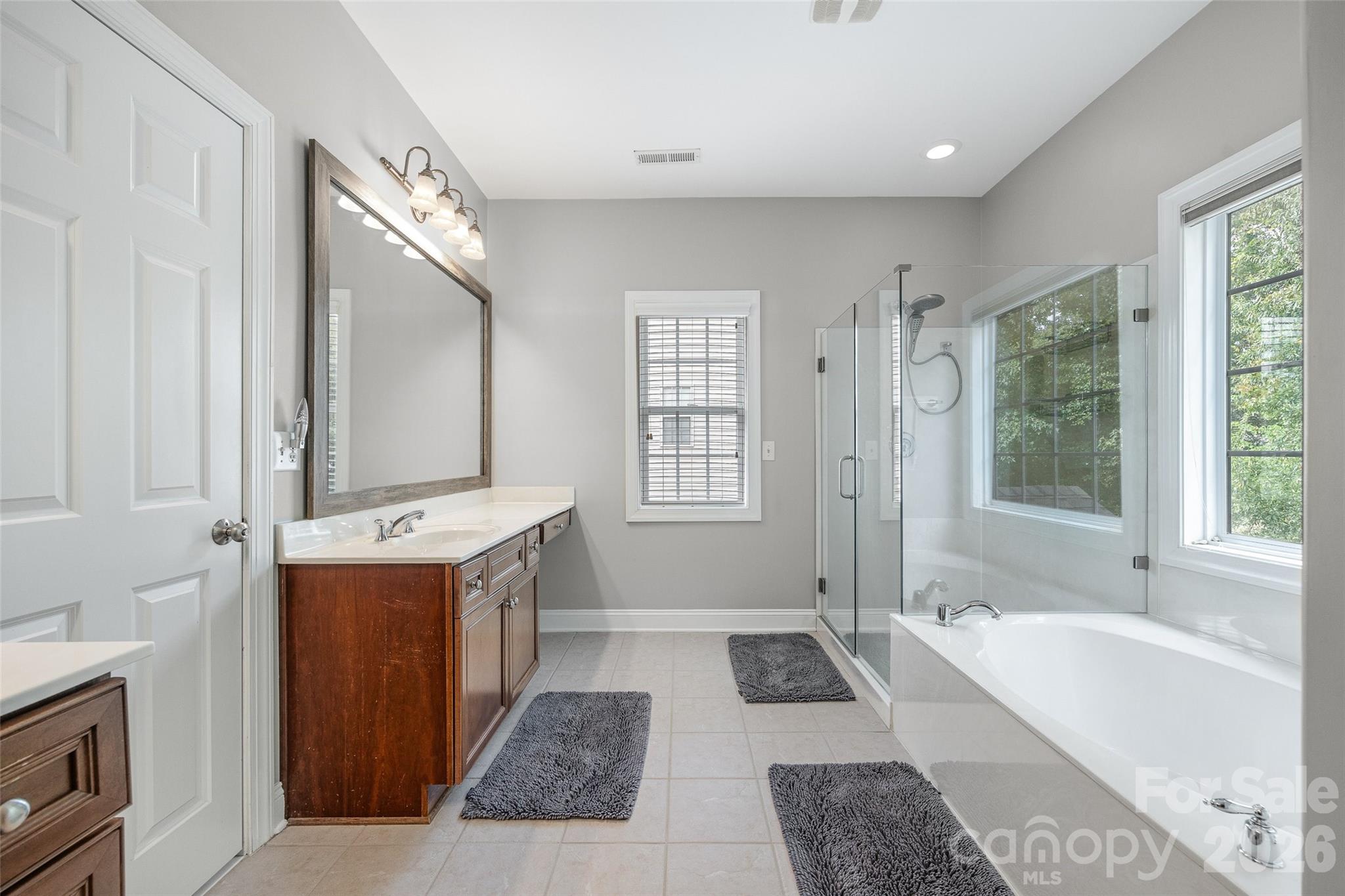 1576 Abercorn Street Northwest Concord, NC 28027 - Photo 33 of 48 a spacious bathroom with sink shower and bathtub
