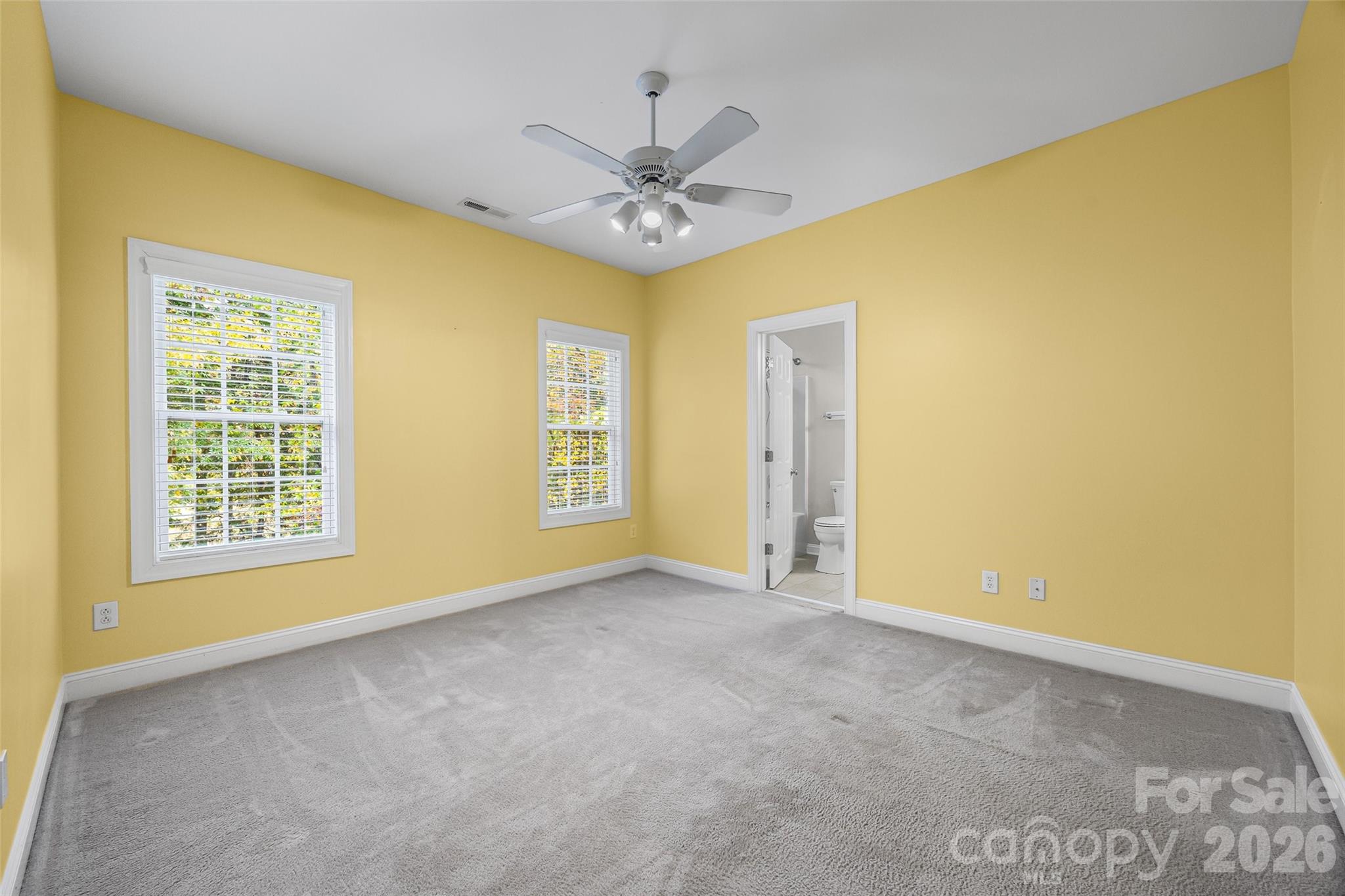 1576 Abercorn Street Northwest Concord, NC 28027 - Photo 37 of 48 an empty room with a ceiling fan and a window