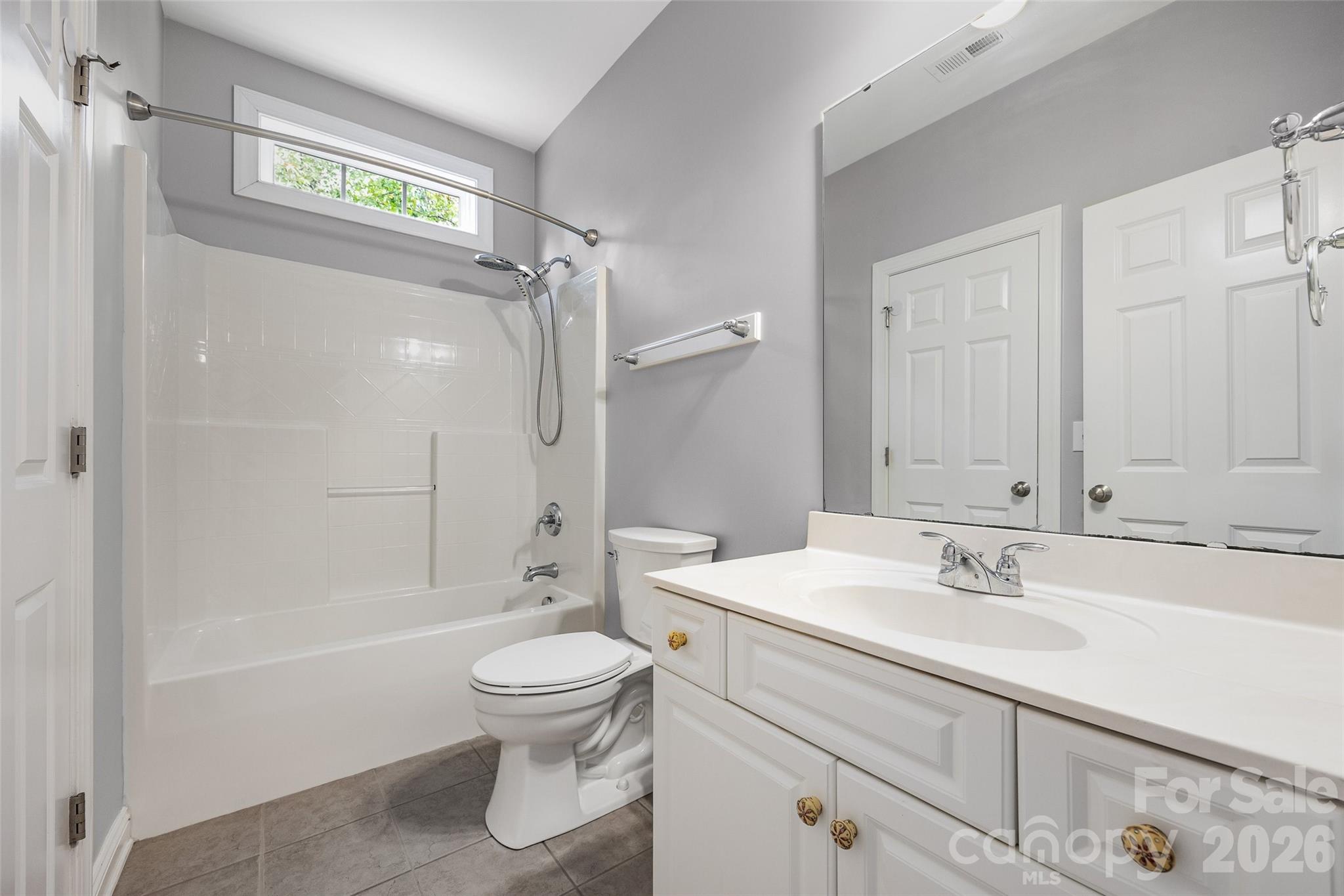 1576 Abercorn Street Northwest Concord, NC 28027 - Photo 41 of 48 a bathroom with a sink a toilet and a bathtub