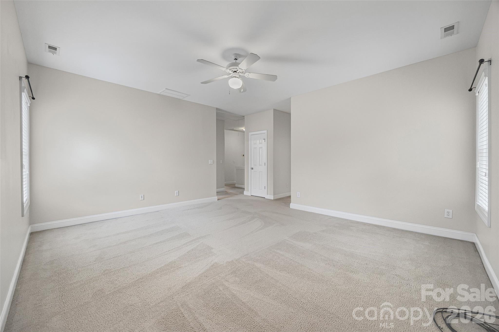 1576 Abercorn Street Northwest Concord, NC 28027 - Photo 43 of 48 a view of an empty room with a ceiling fan
