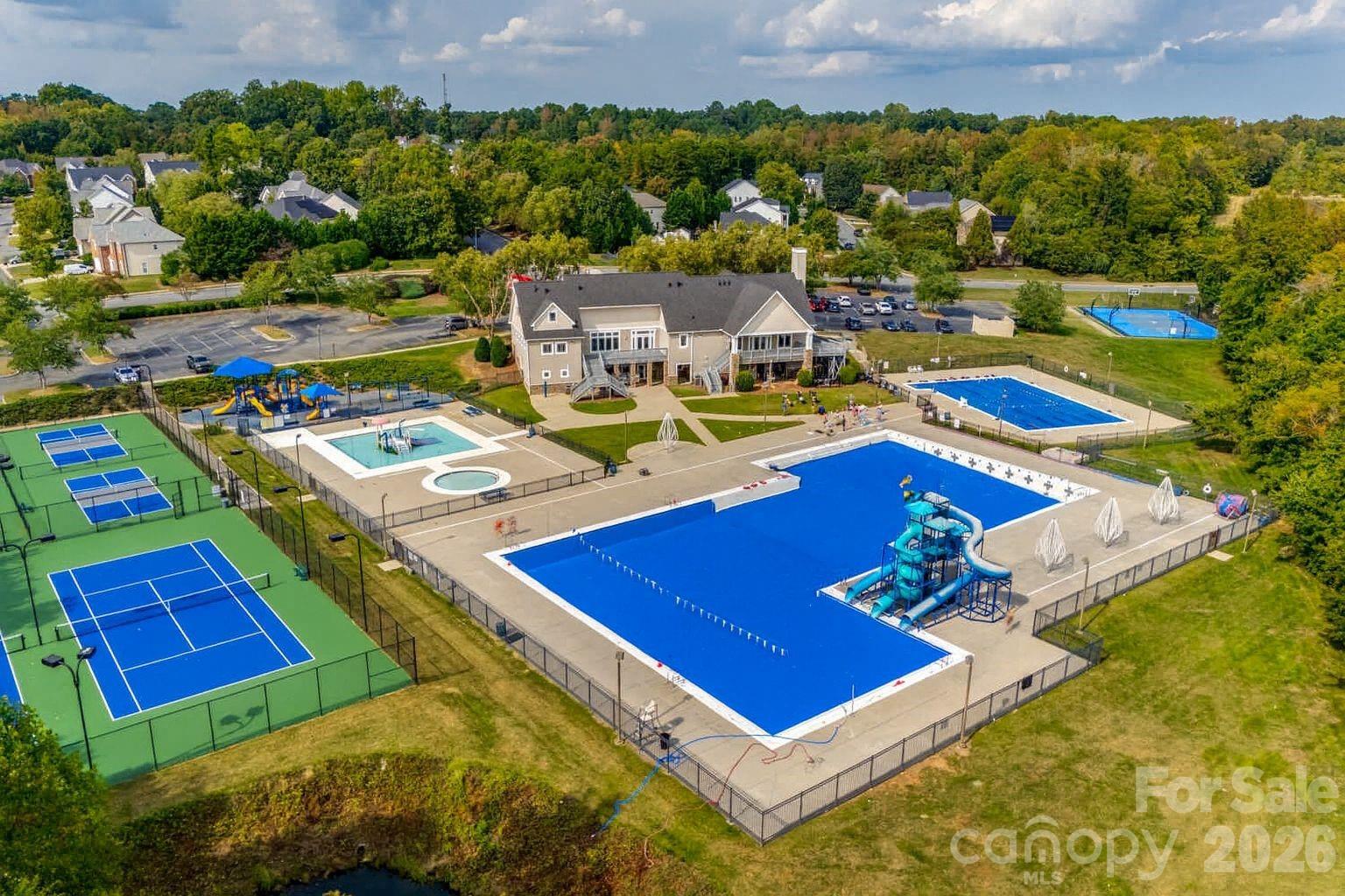 1576 Abercorn Street Northwest Concord, NC 28027 - Photo 47 of 48 a view of a pool with lawn chairs and couches