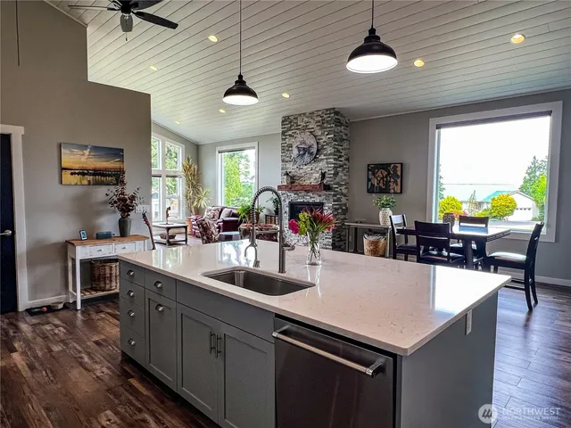 a kitchen with sink and center island