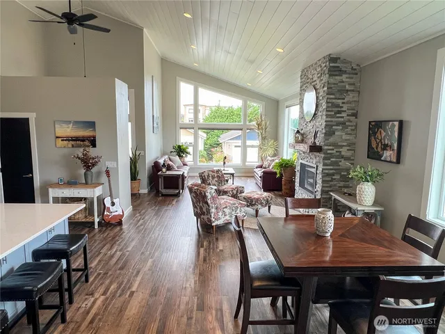 a view of a dining room with furniture window and wooden floor