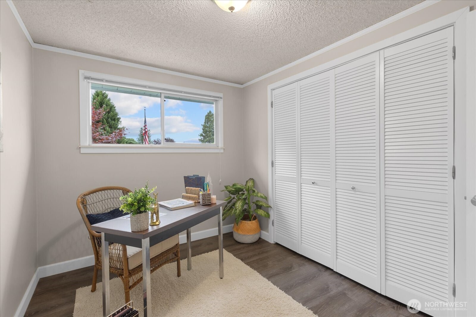 1202 44th Street Southeast Everett, WA 98203 - Photo 15 of 38 a view of a workspace room with furniture and a potted plant