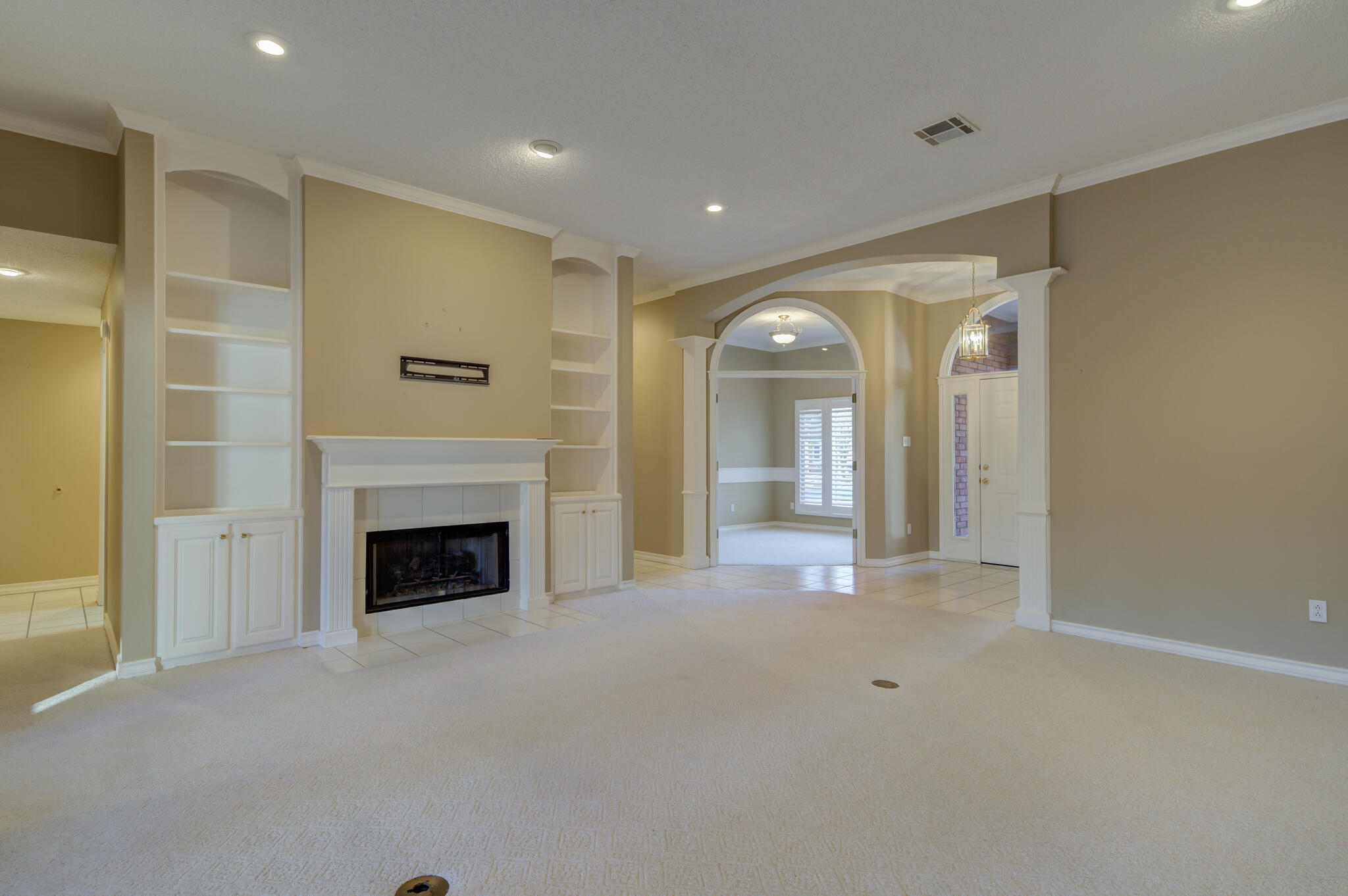 5917 85th Street Lubbock, TX 79424 - Photo 12 of 51 a view of an empty room with a fireplace