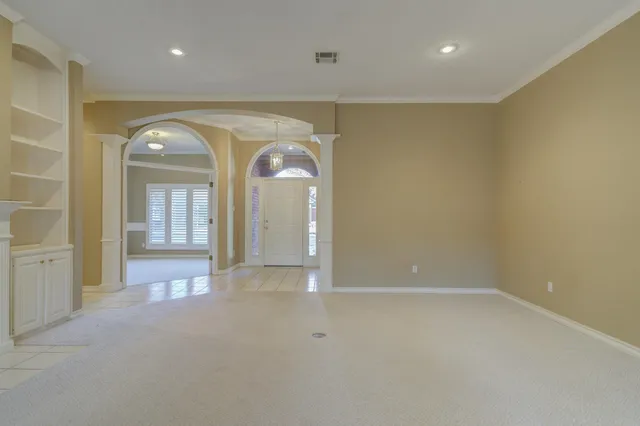 wooden floor in a room with a mirror