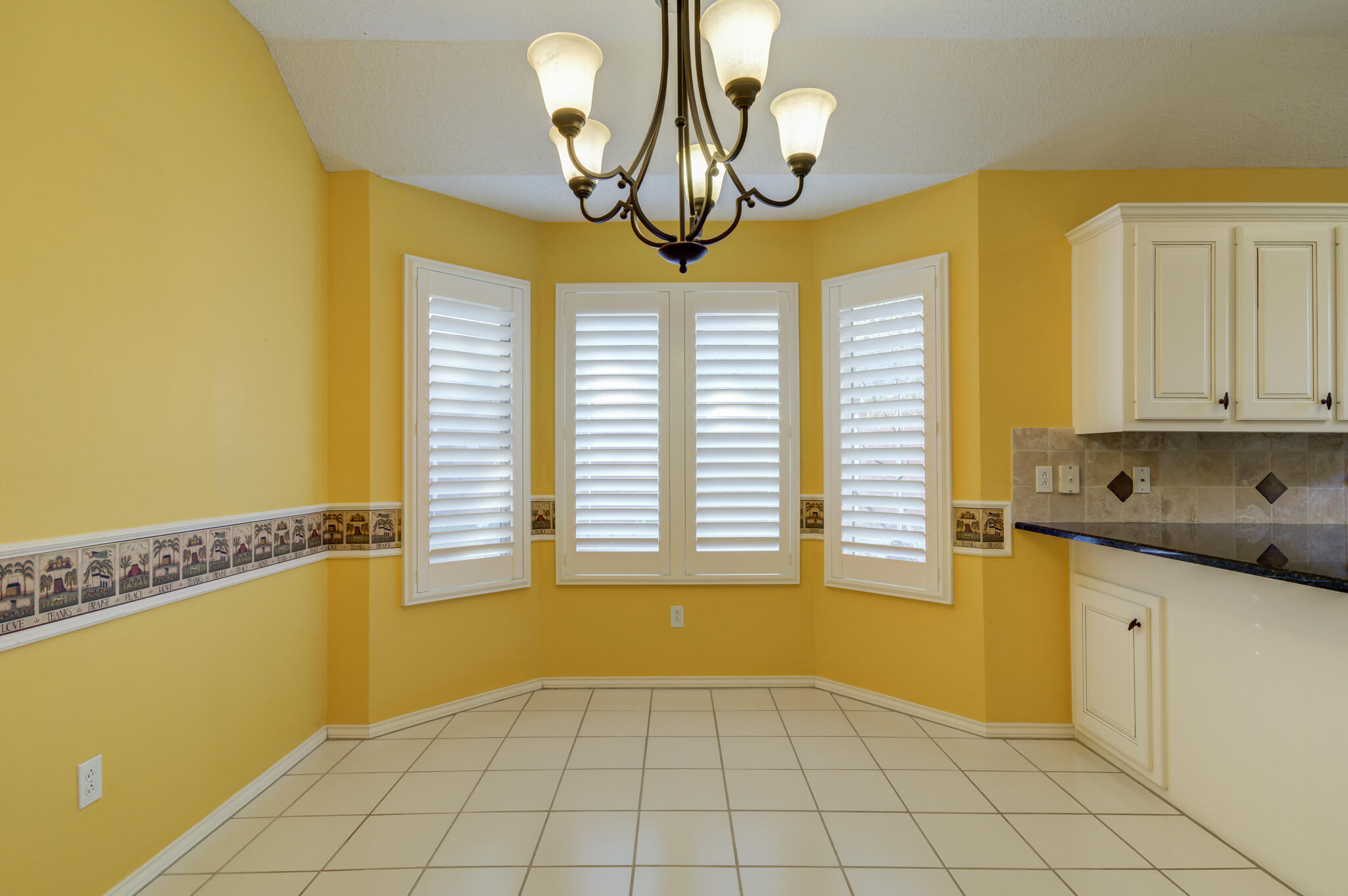 5917 85th Street Lubbock, TX 79424 - Photo 18 of 51 a view of a kitchen with a sink and chandelier fan