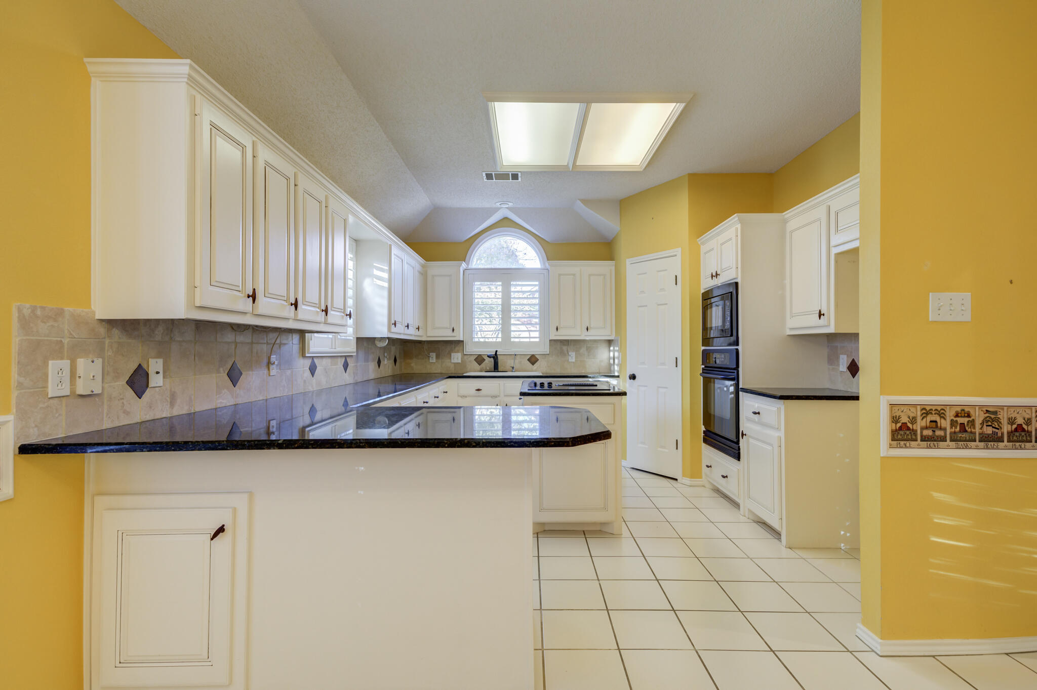 5917 85th Street Lubbock, TX 79424 - Photo 20 of 51 a kitchen with stainless steel appliances granite countertop a sink a refrigerator and a stove