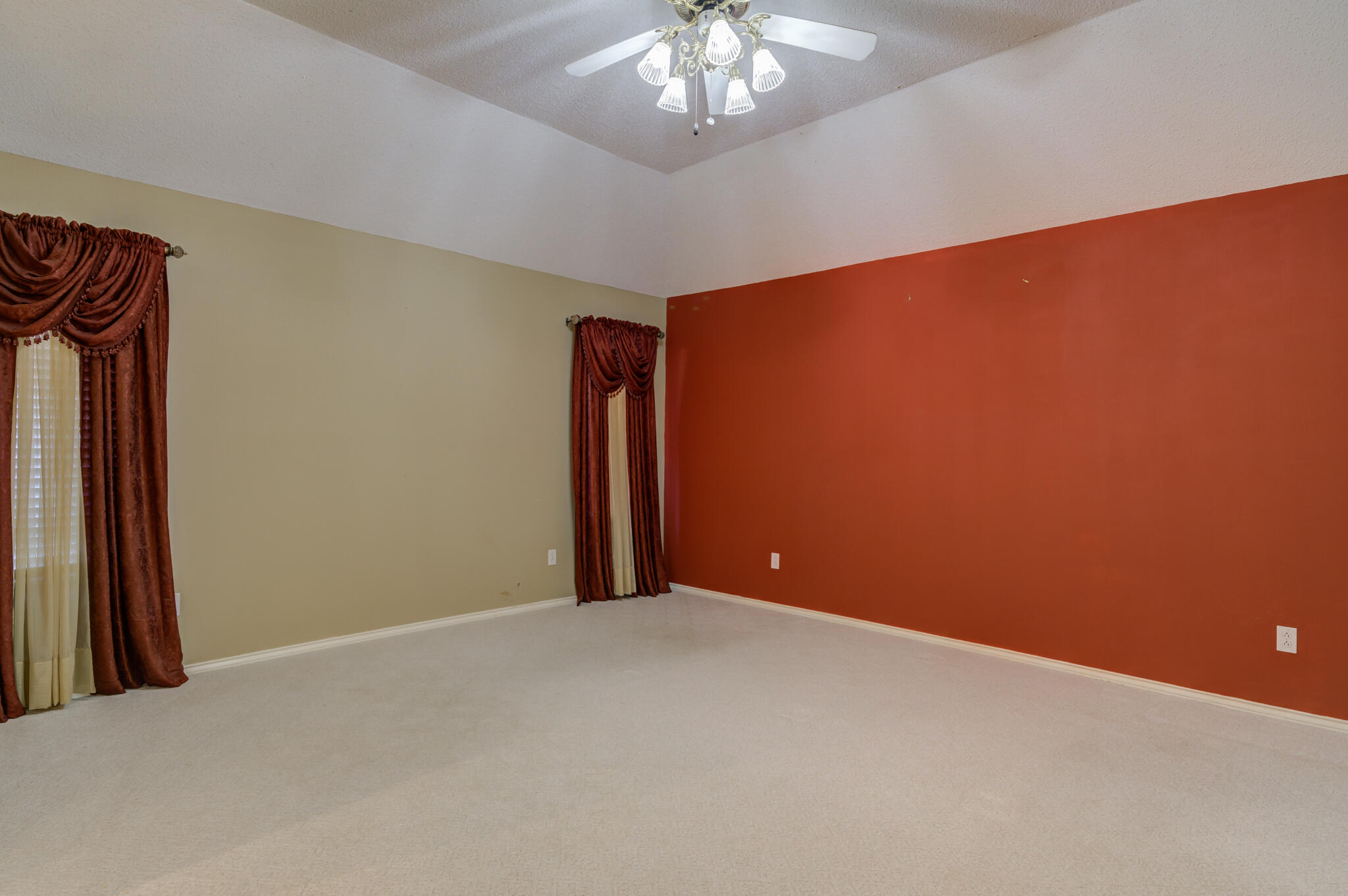 5917 85th Street Lubbock, TX 79424 - Photo 29 of 51 a view of an empty room with a chandelier fan