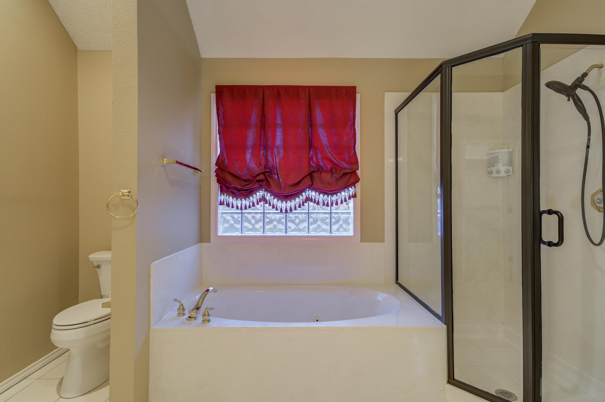 5917 85th Street Lubbock, TX 79424 - Photo 34 of 51 a bathroom with a tub sink and toilet