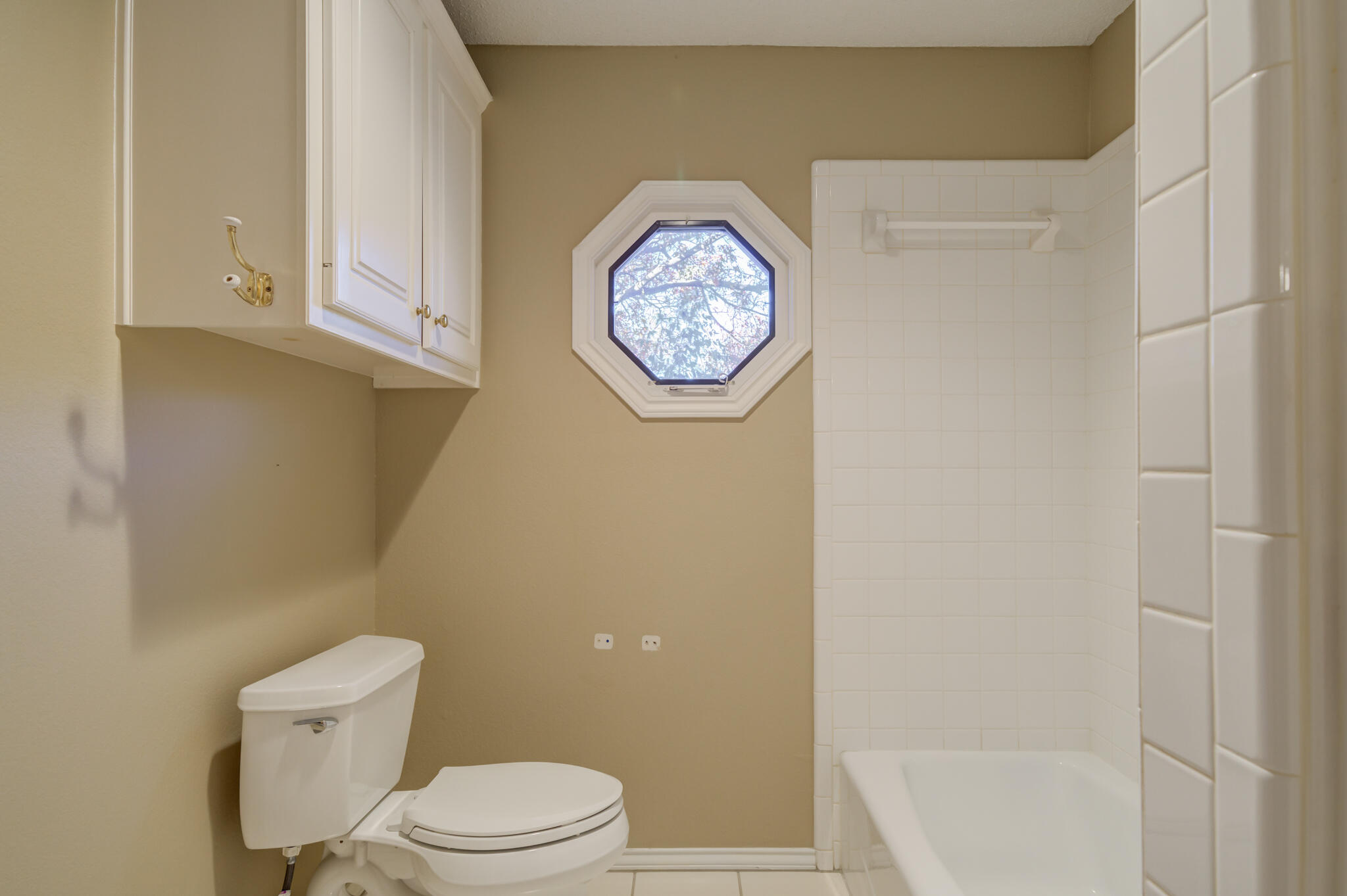 5917 85th Street Lubbock, TX 79424 - Photo 41 of 51 a bathroom with a toilet and a bathtub