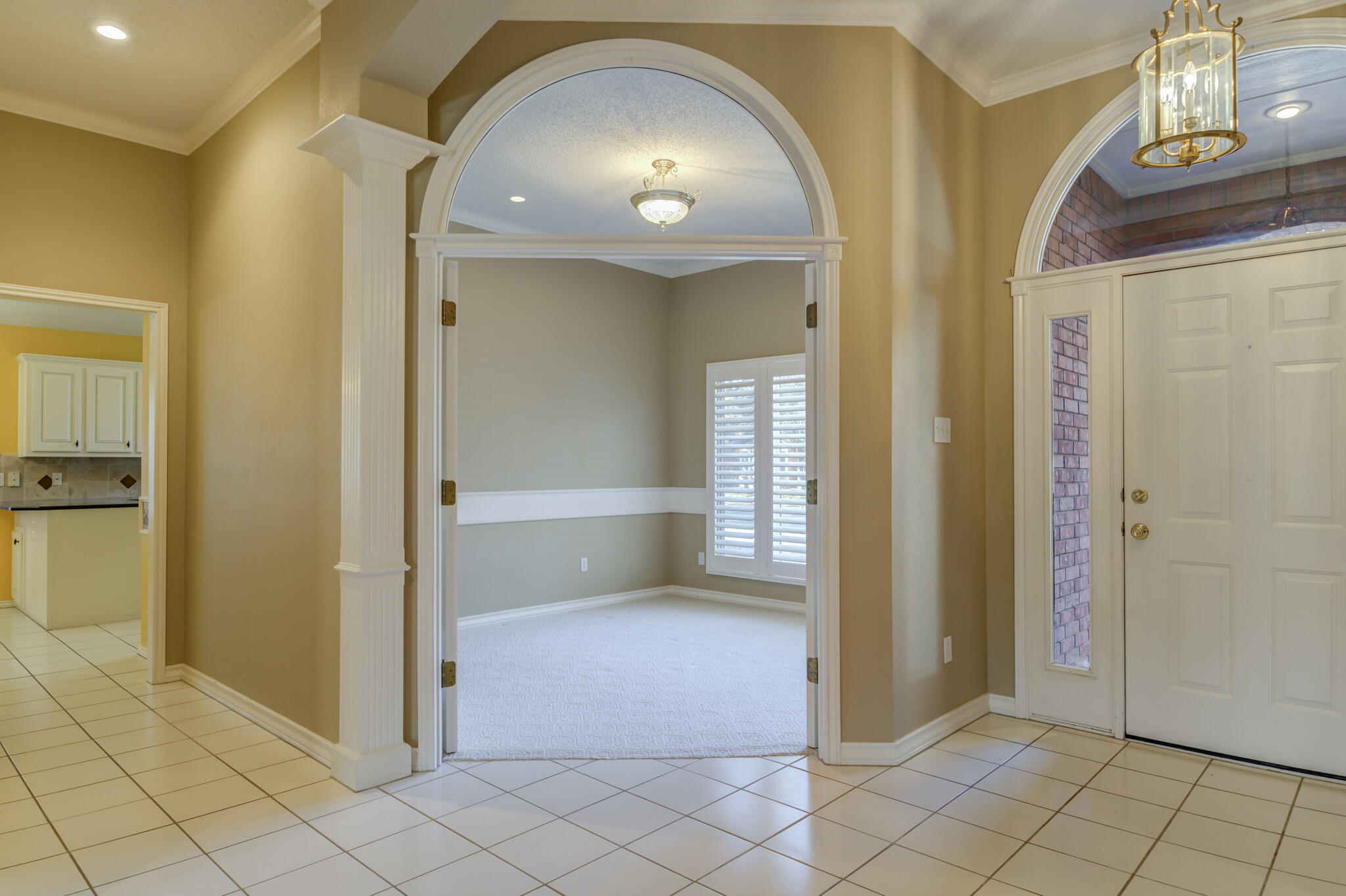 5917 85th Street Lubbock, TX 79424 - Photo 5 of 51 a view of a hallway with wooden shelves