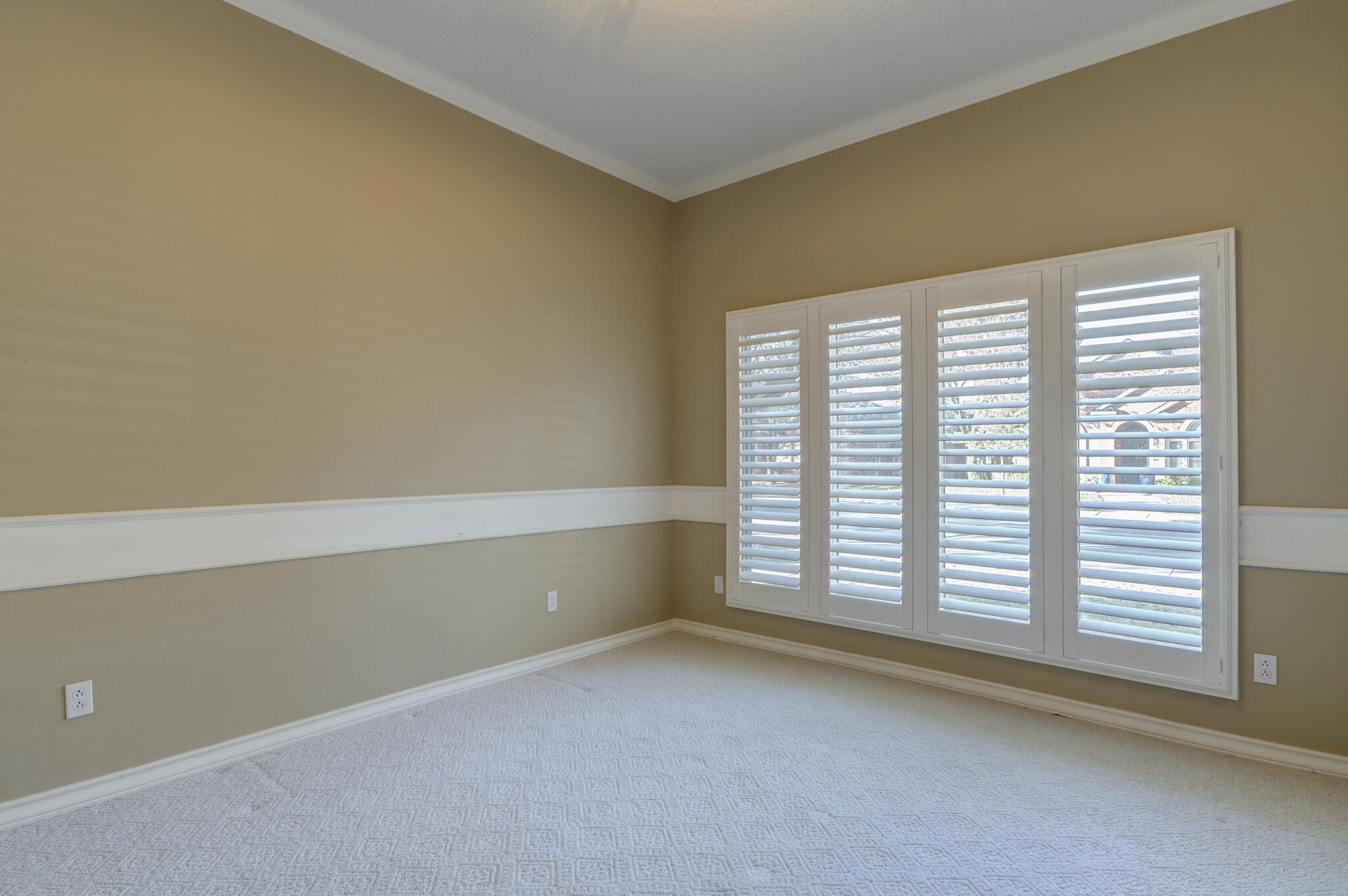 5917 85th Street Lubbock, TX 79424 - Photo 6 of 51 a view of an empty room with a window
