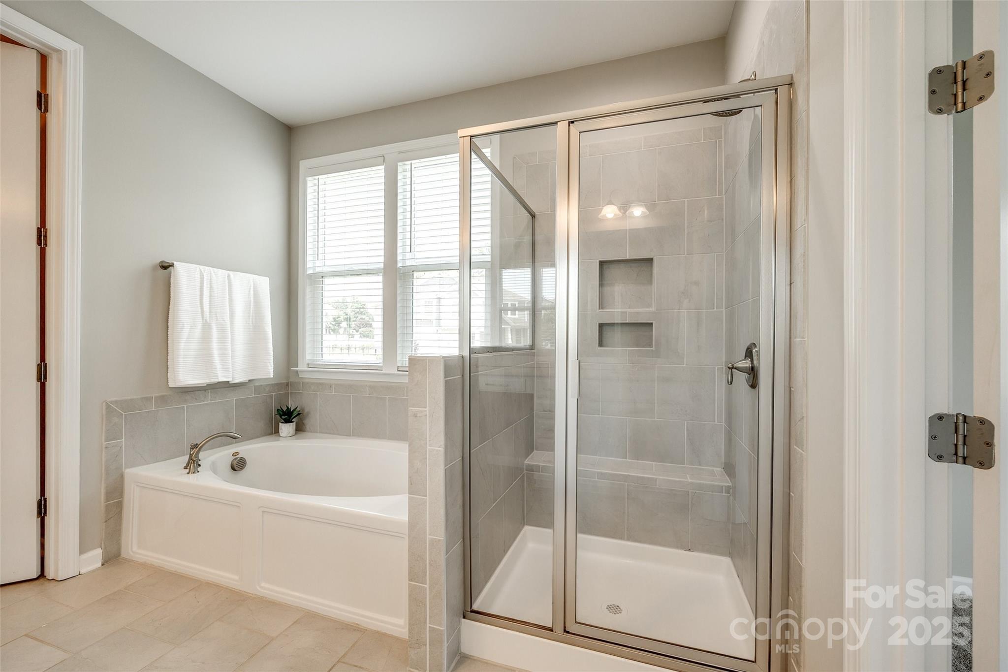 173 Morgan's Branch Road Belmont, NC 28012 - Photo 14 of 29 a white bath tub sitting next to a shower