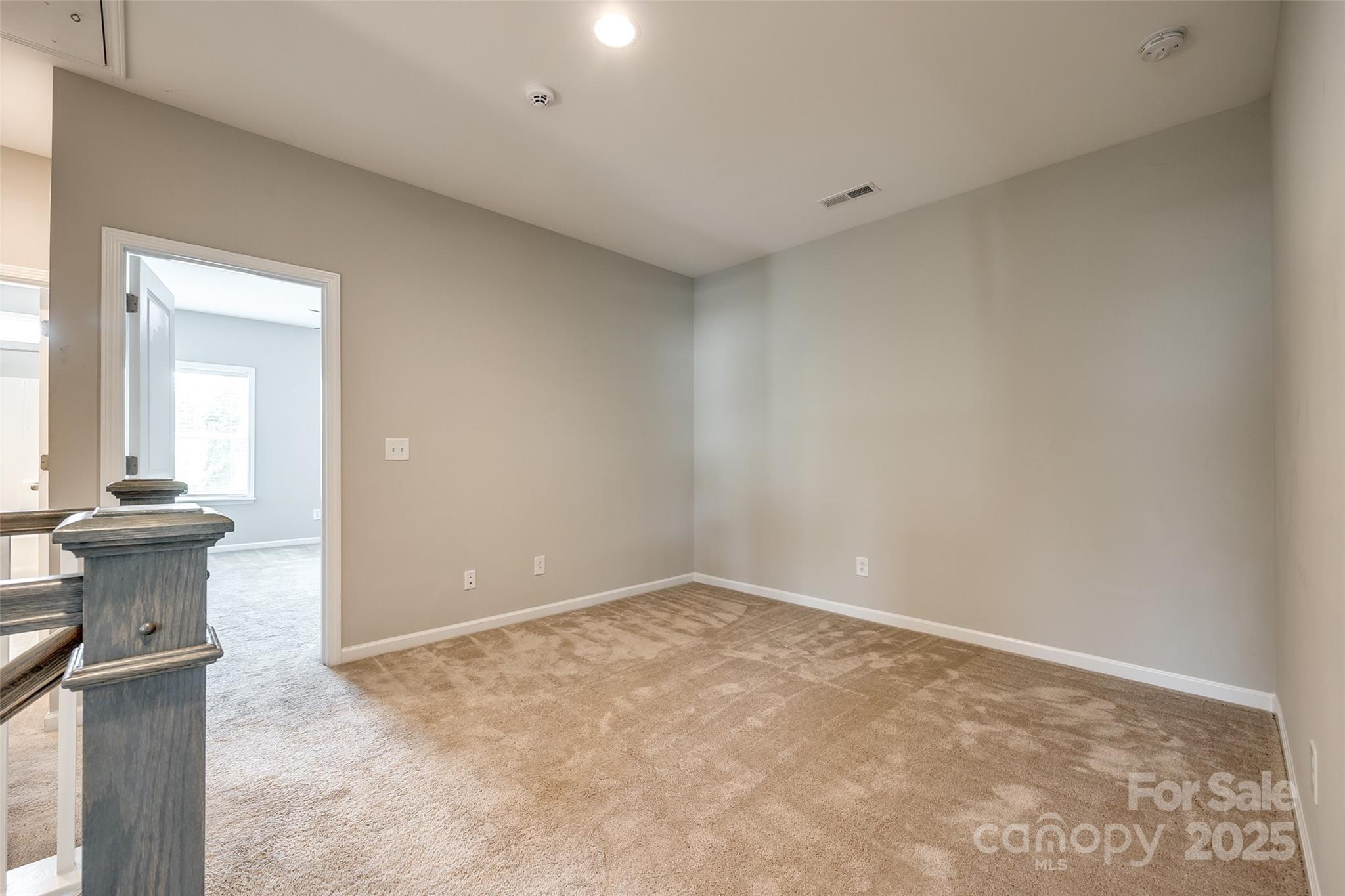 173 Morgan's Branch Road Belmont, NC 28012 - Photo 18 of 29 a view of a livingroom with wooden floor and a fireplace