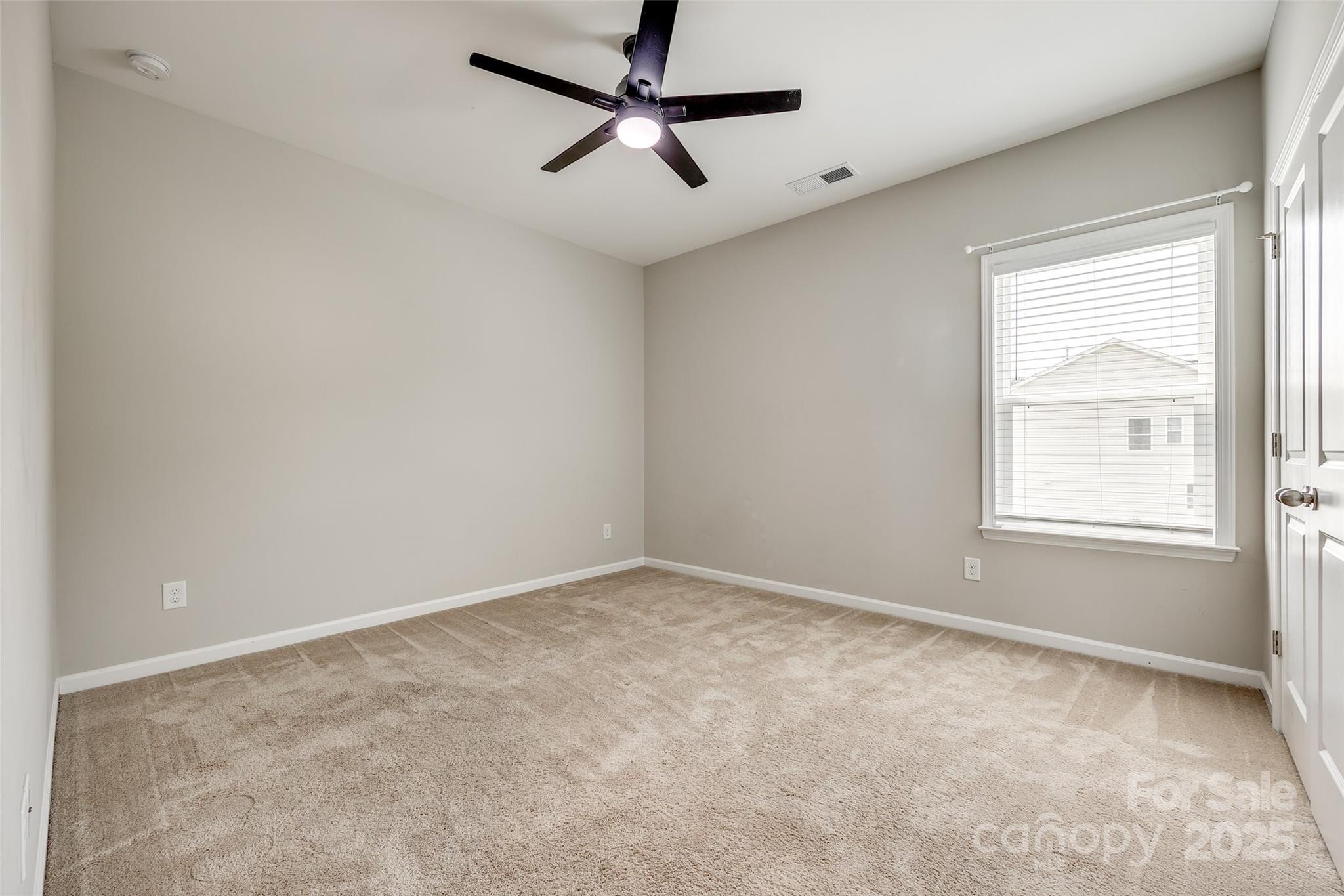 173 Morgan's Branch Road Belmont, NC 28012 - Photo 19 of 29 an empty room with a window and a fan