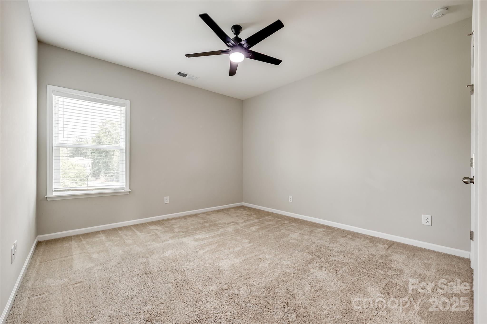 173 Morgan's Branch Road Belmont, NC 28012 - Photo 22 of 29 an empty room with ceiling fan and window