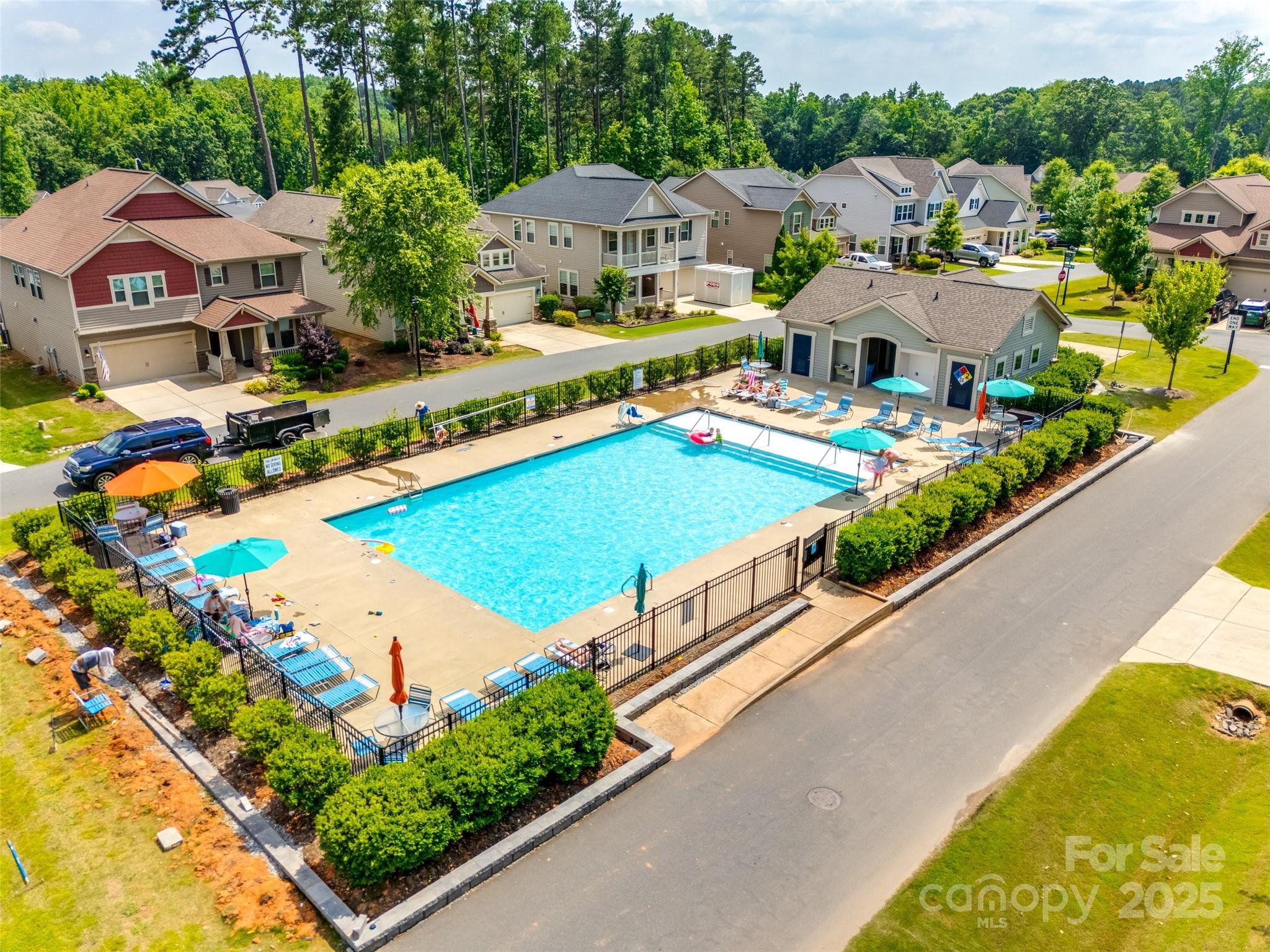 173 Morgan's Branch Road Belmont, NC 28012 - Photo 26 of 29 an aerial view of a house with swimming pool patio and lake view