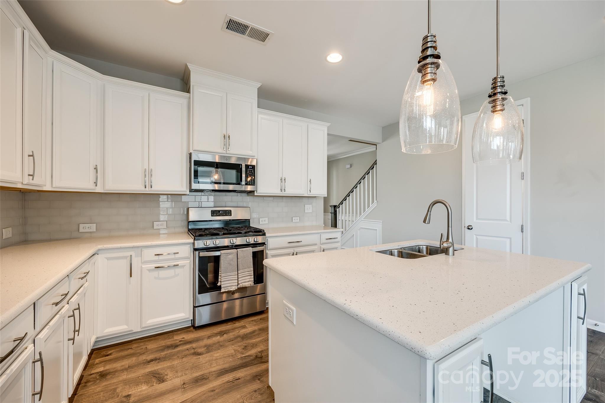 173 Morgan's Branch Road Belmont, NC 28012 - Photo 4 of 29 a kitchen with a sink a stove and cabinets