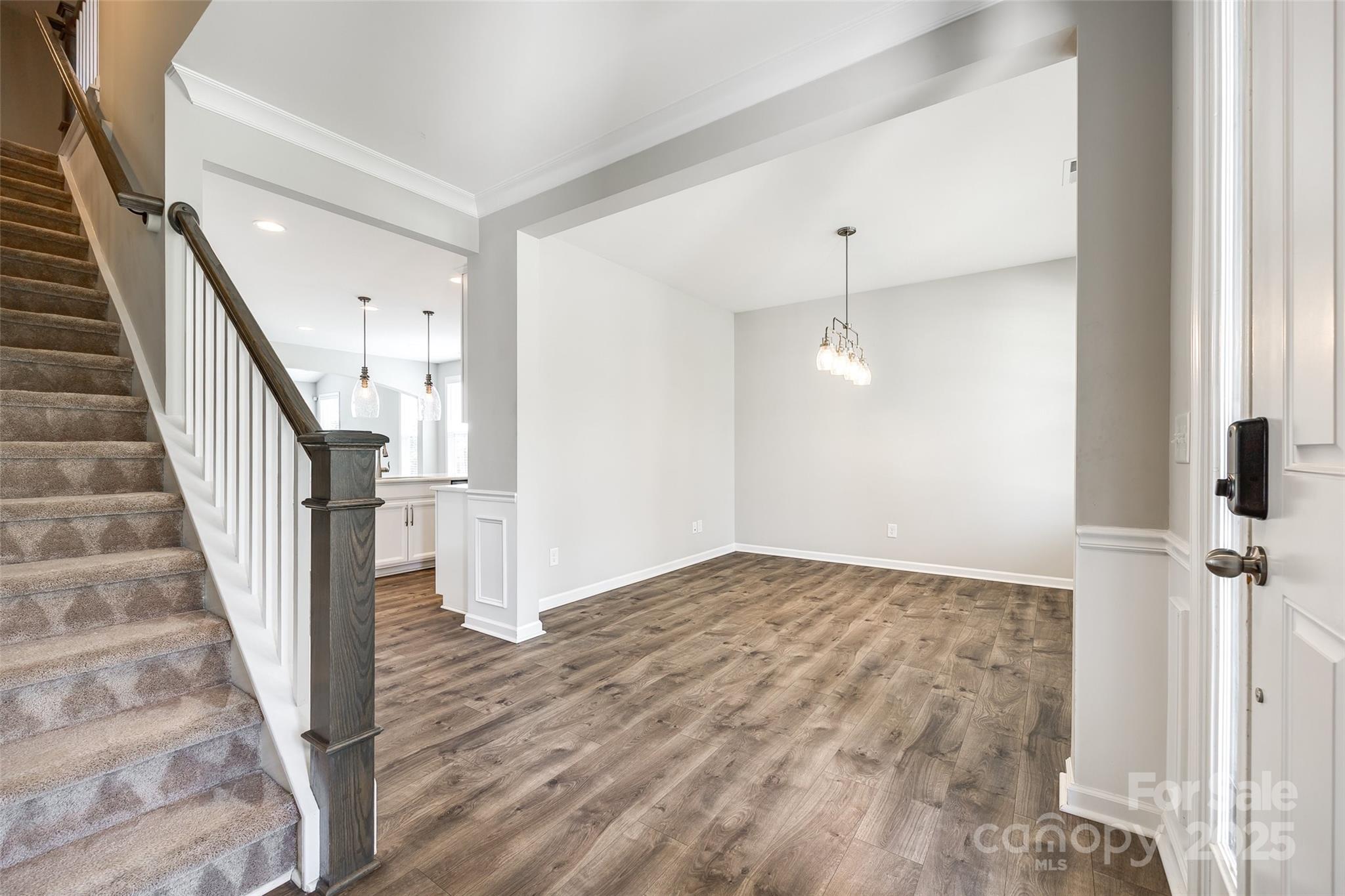 173 Morgan's Branch Road Belmont, NC 28012 - Photo 5 of 29 a view of a hallway with wooden floor and staircase
