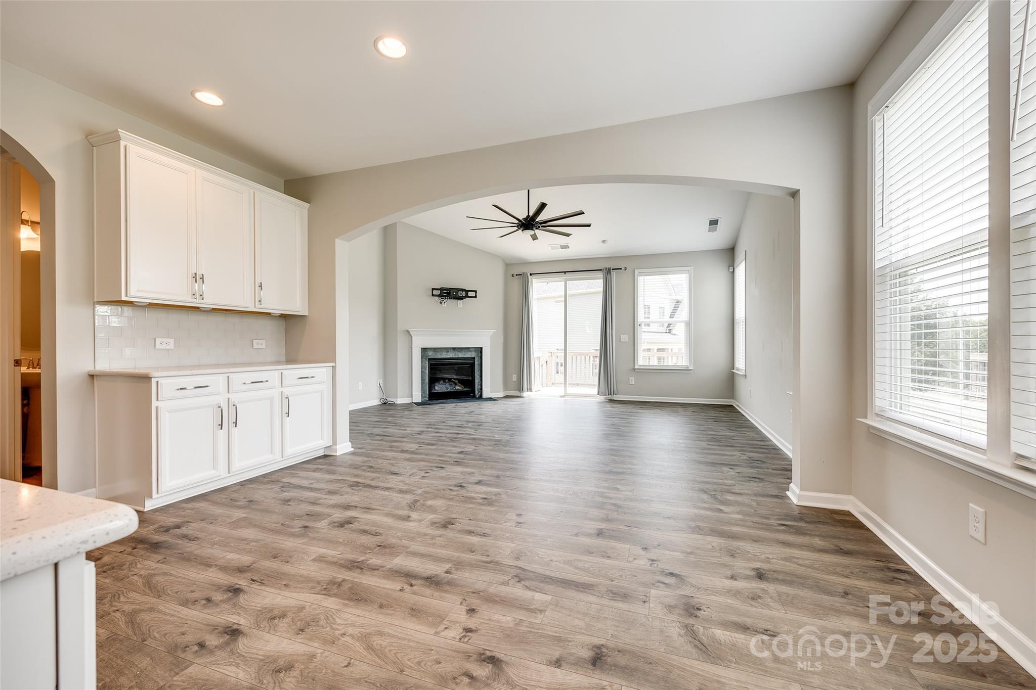 173 Morgan's Branch Road Belmont, NC 28012 - Photo 7 of 29 a view of kitchen and window with wooden floor