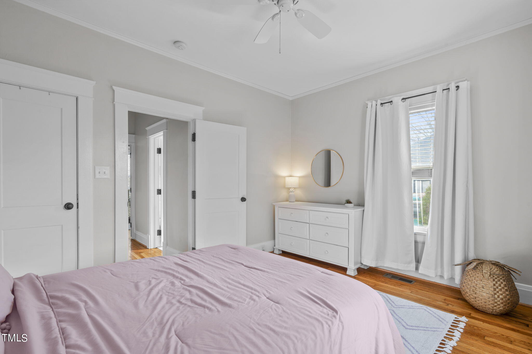 529 Euclid Street Raleigh, NC 27604 - Photo 12 of 37 a bedroom with a bed and a dresser