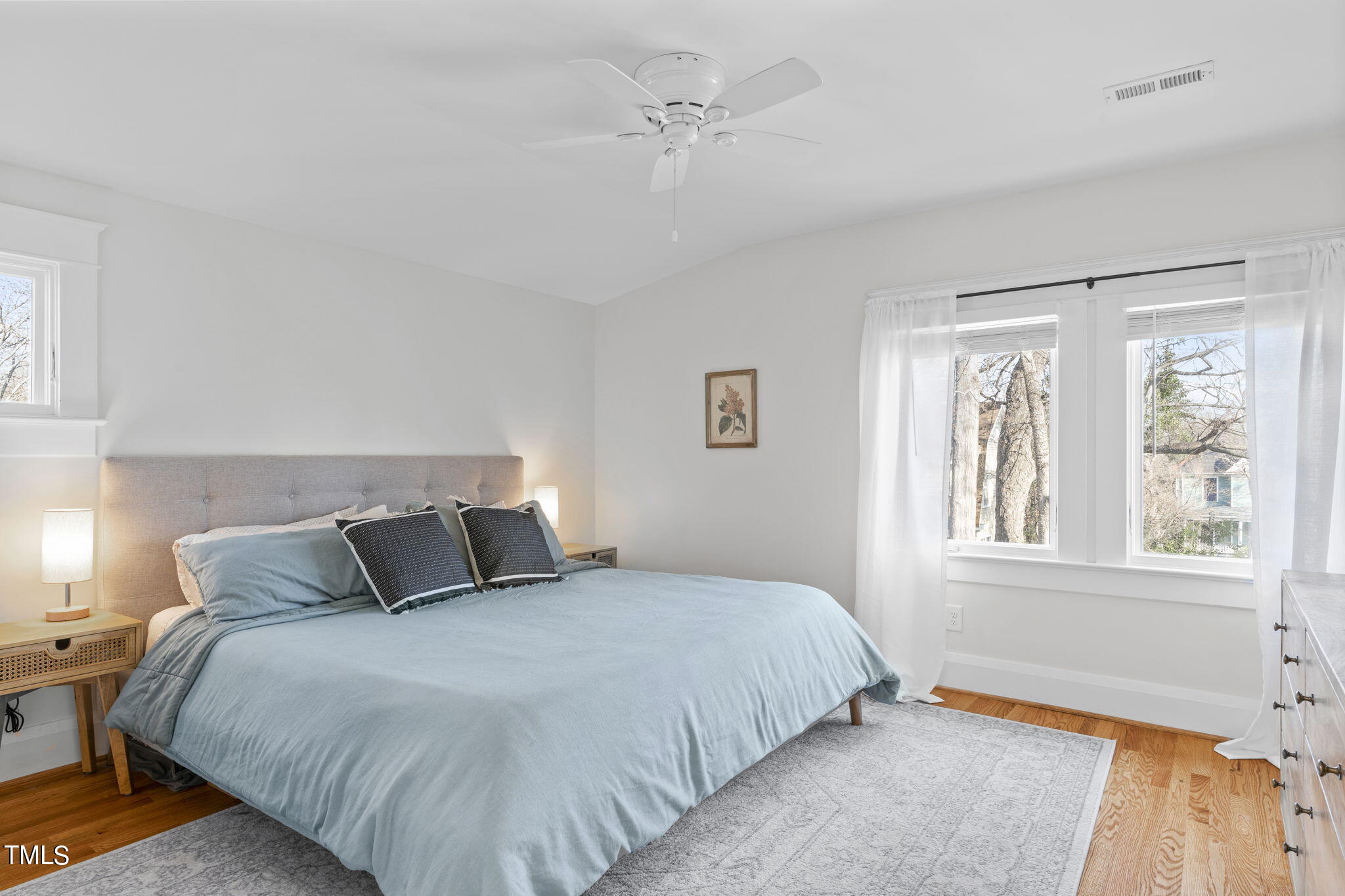 529 Euclid Street Raleigh, NC 27604 - Photo 23 of 37 a bedroom with a large bed and a window
