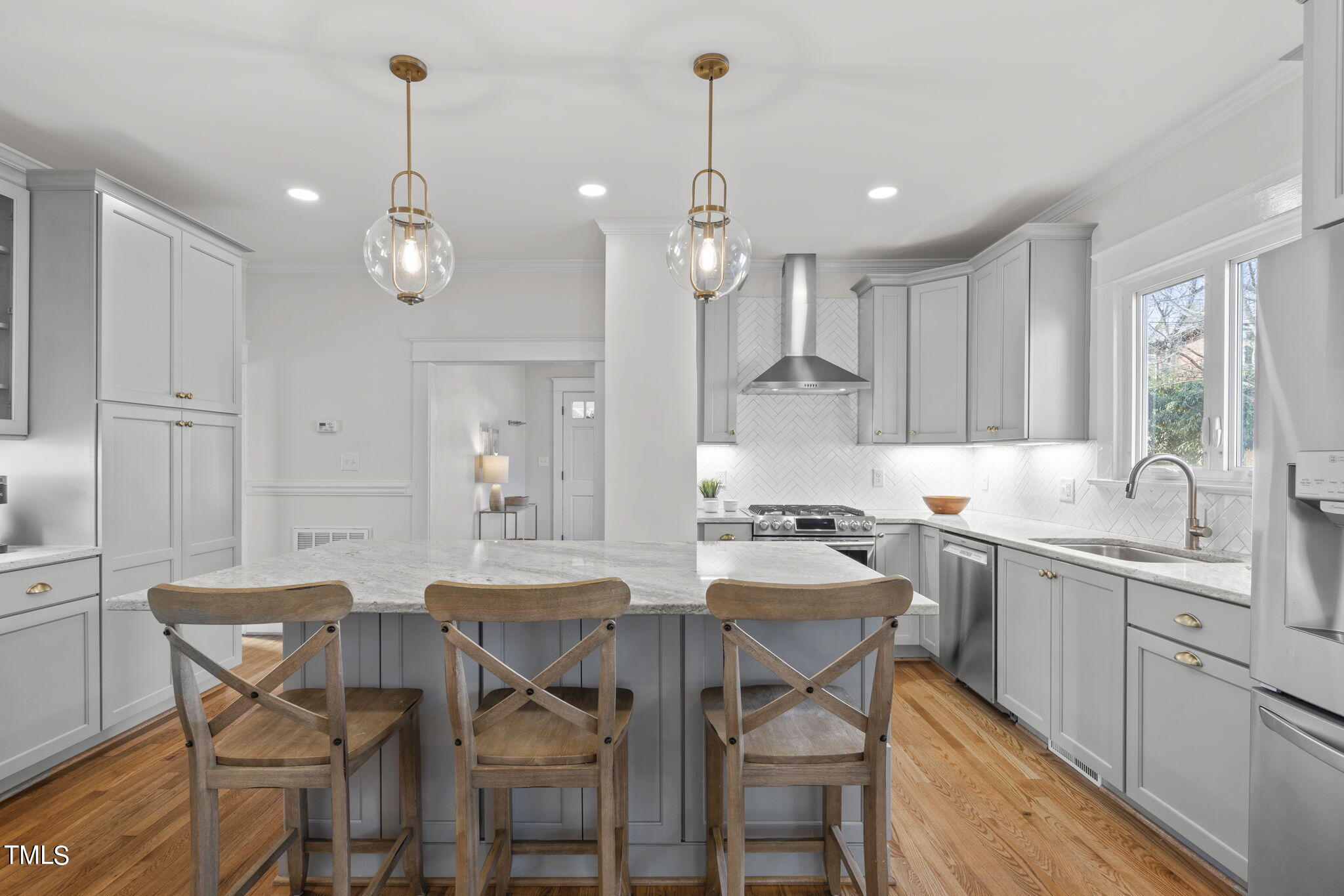 529 Euclid Street Raleigh, NC 27604 - Photo 8 of 37 a kitchen with a dining table chairs sink and cabinets