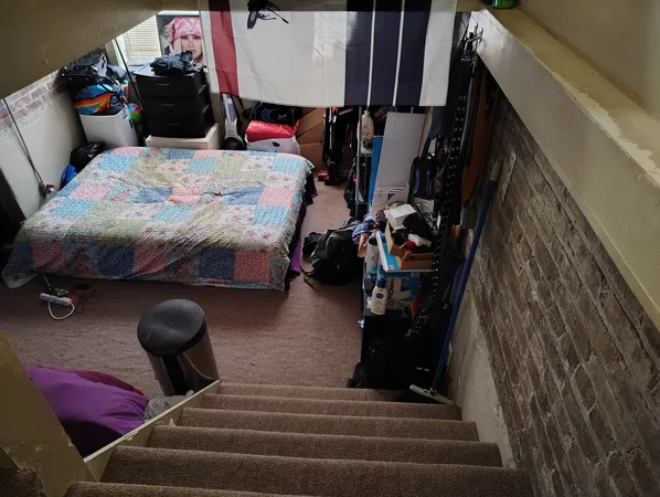a bedroom with furniture and a gym equipment