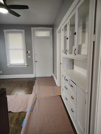 a kitchen with stainless steel appliances wooden cabinets and a stove top oven
