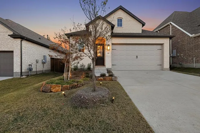 a front view of a house with parking