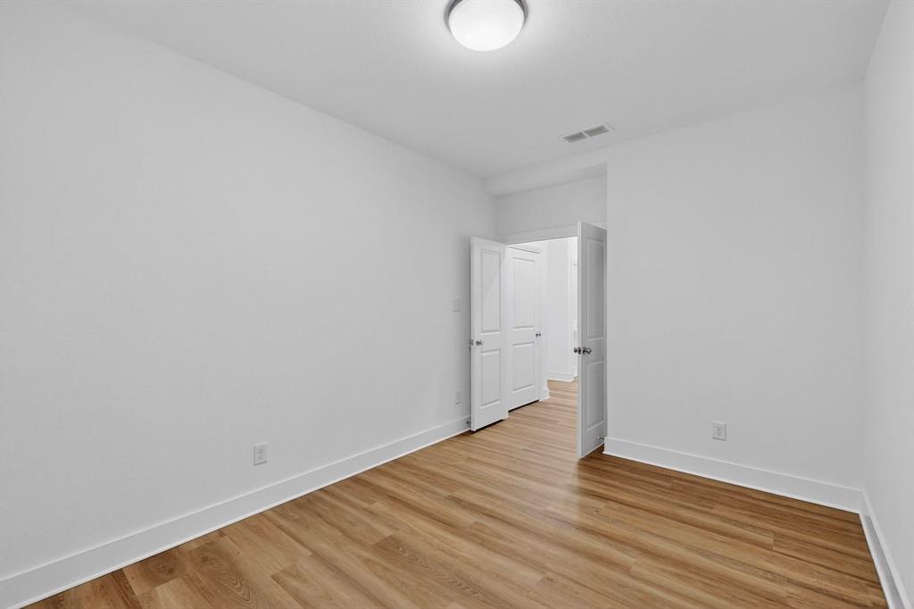 1232 Newport Street Sherman, TX 75090 - Photo 25 of 40 a view of an empty room with wooden floor
