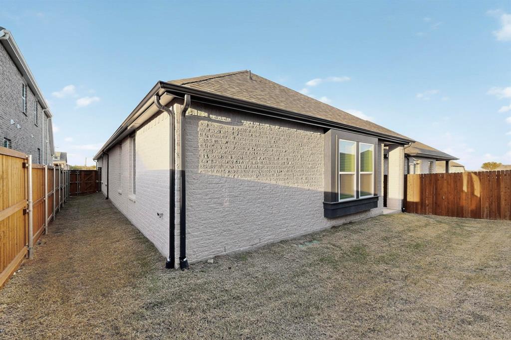 1232 Newport Street Sherman, TX 75090 - Photo 38 of 40 a view of a house with wooden fence