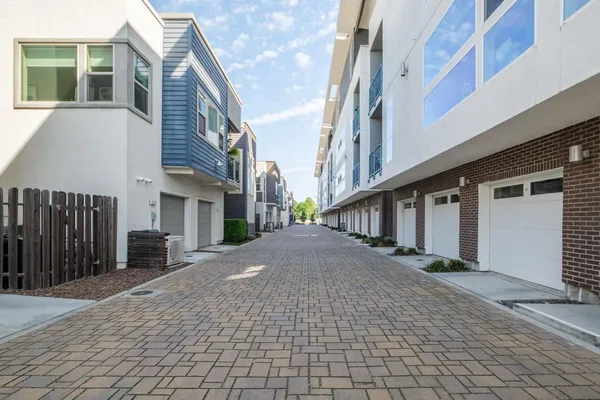 a view of a park with a bench and trees