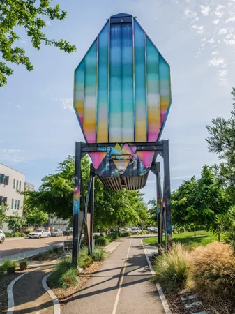 a view of a yard with plants and a bench