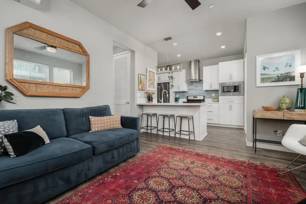 a living room with furniture and a potted plant
