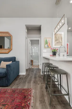 a kitchen with stainless steel appliances a stove top oven and sink